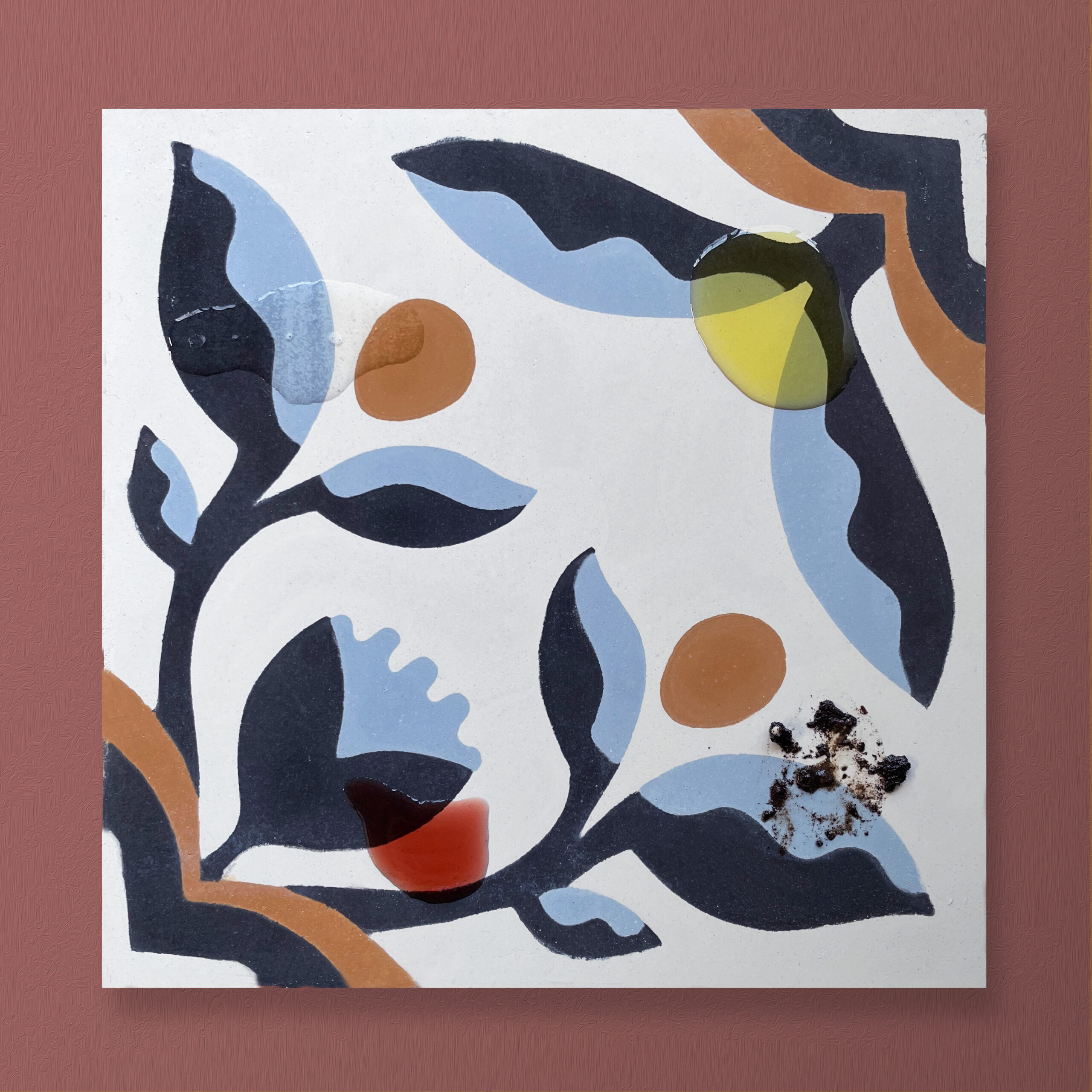 Cement tile with wine, oil, lemon juice, and dirt.